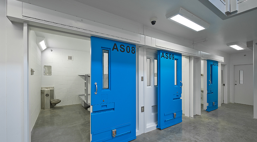 Correctional Cell Lighting featuring group of three prison cells