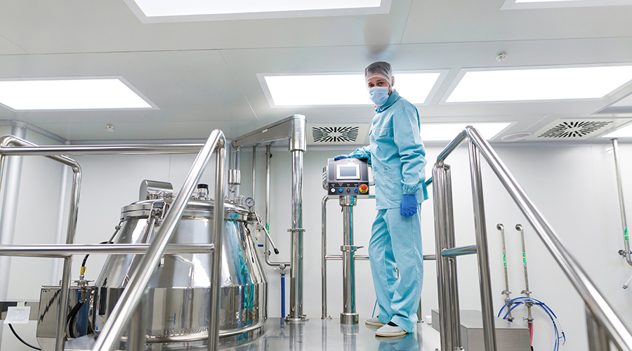 Cleanroom and Containment Plenum Access Lighting featuring worker on raised platform